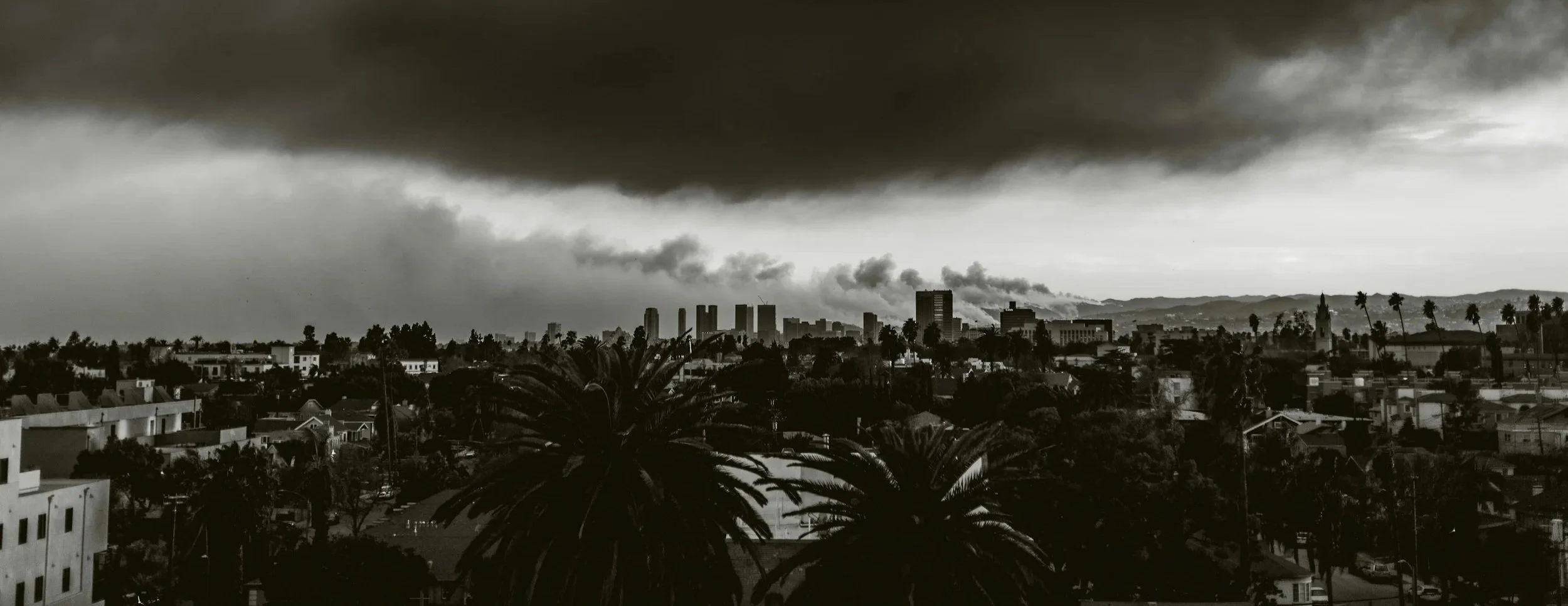 Los Angeles landscape beneath storm clouds